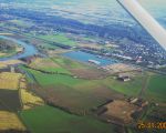 Het verwerkingsbekken gezien vanuit de lucht met op de voorgrond het gronddepot. Aan de linkerkant in het midden van de foto ziet u de bocht van de Maas bij Voulwammes. (25-1-2009 - Maurice en Emile Winkens)