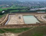 Het verwerkingsbekken is al gedeeltelijk verdiept, op de achtergrond Bunde. (15-10-2008 - Waterschap Roer en Overmaas)