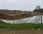 Dumpers rijden in Borgharen af en aan met afgegraven dekgrond.  (5-4-2011 - Jan Dolmans)